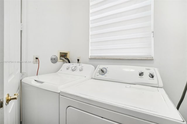 clothes washing area featuring washer and dryer