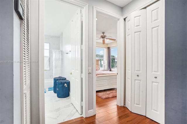 hall with light hardwood / wood-style flooring