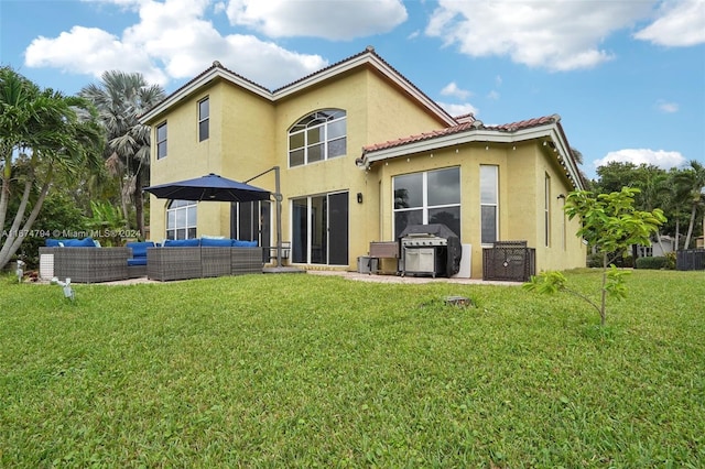 back of property with a patio, a yard, and an outdoor living space