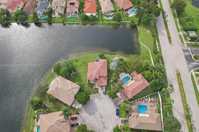 birds eye view of property with a water view