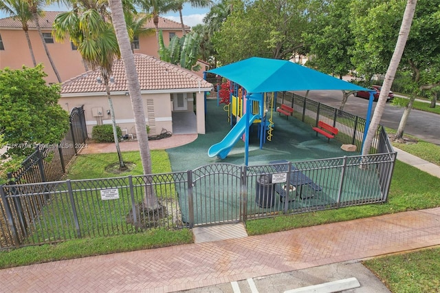 view of jungle gym with a lawn