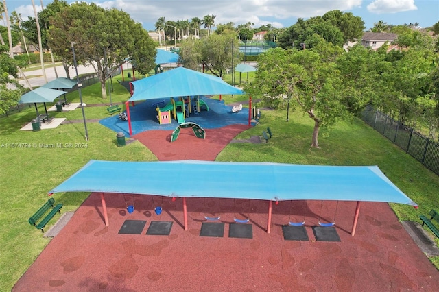 view of pool featuring a playground and a yard