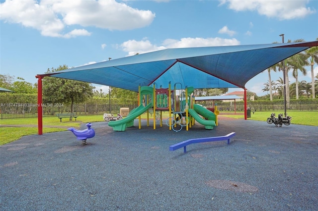 view of playground with a lawn