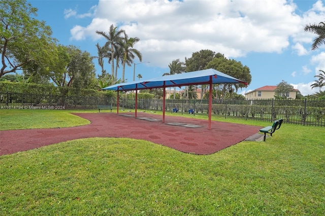 view of property's community featuring a playground and a lawn