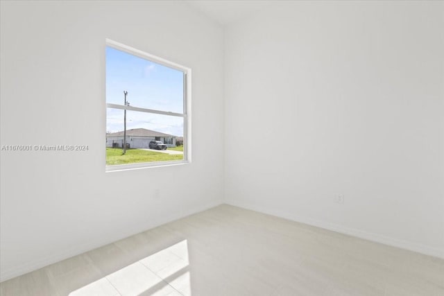 spare room featuring light tile patterned floors