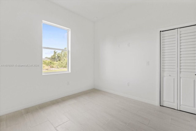 unfurnished bedroom featuring a closet