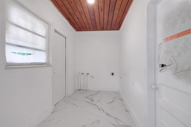 clothes washing area featuring electric dryer hookup and wooden ceiling