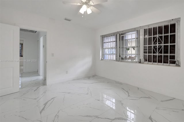 unfurnished room featuring ceiling fan