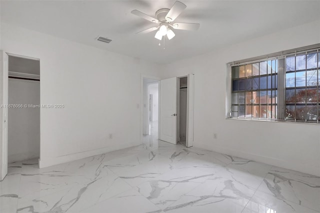 unfurnished bedroom featuring ceiling fan