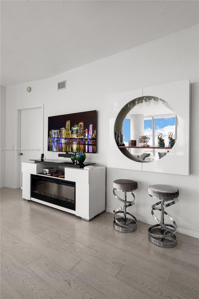 bar featuring hardwood / wood-style floors