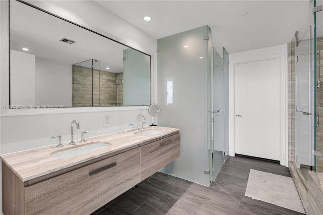 bathroom with vanity and an enclosed shower