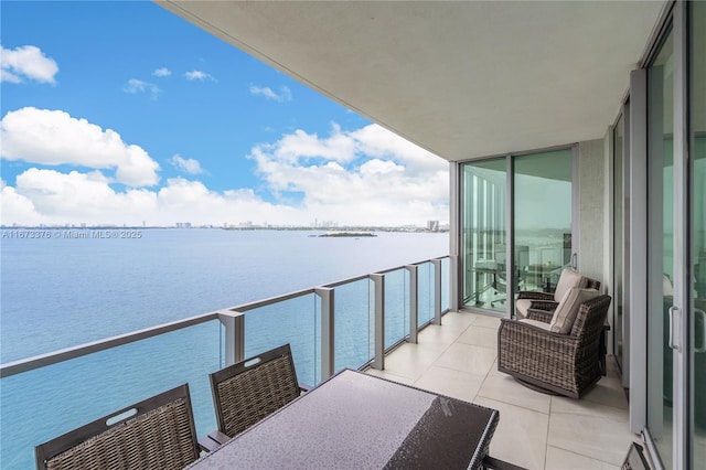 balcony featuring a water view