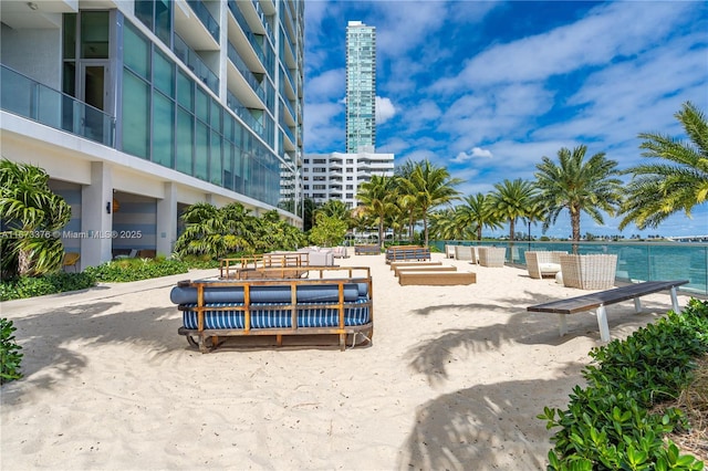 surrounding community featuring a water view