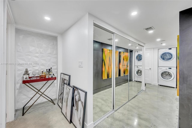 laundry room with stacked washer and dryer