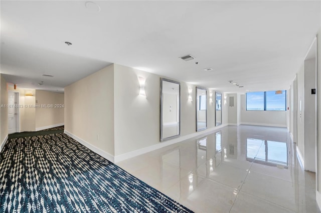 hallway featuring tile patterned floors