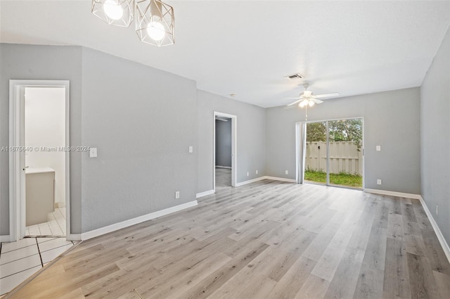 spare room featuring light hardwood / wood-style flooring and ceiling fan