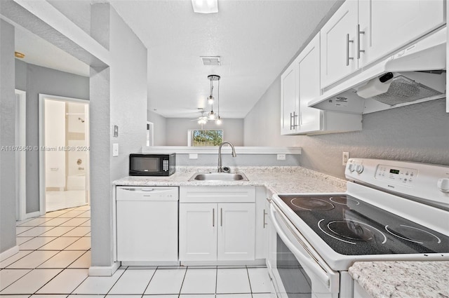 kitchen with white cabinets, sink, decorative light fixtures, and white appliances