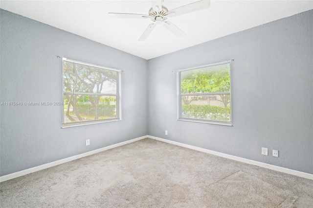 carpeted empty room with ceiling fan