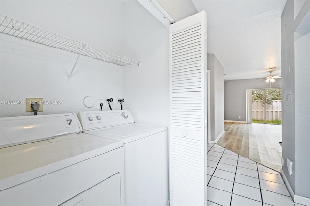 laundry area featuring washer and clothes dryer, ceiling fan, and light tile patterned floors