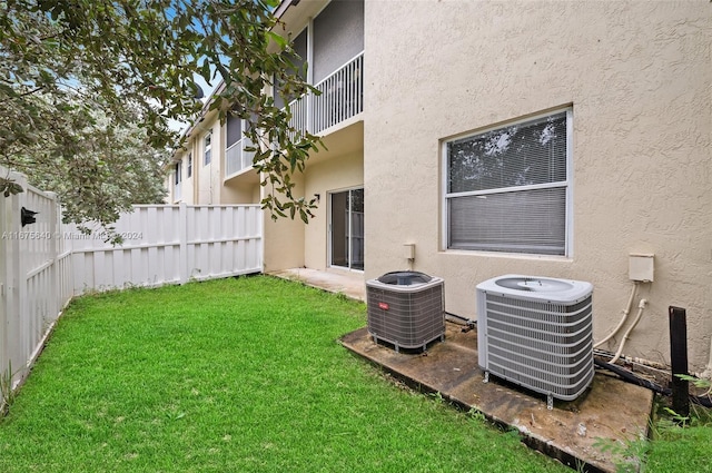 view of yard with central AC unit