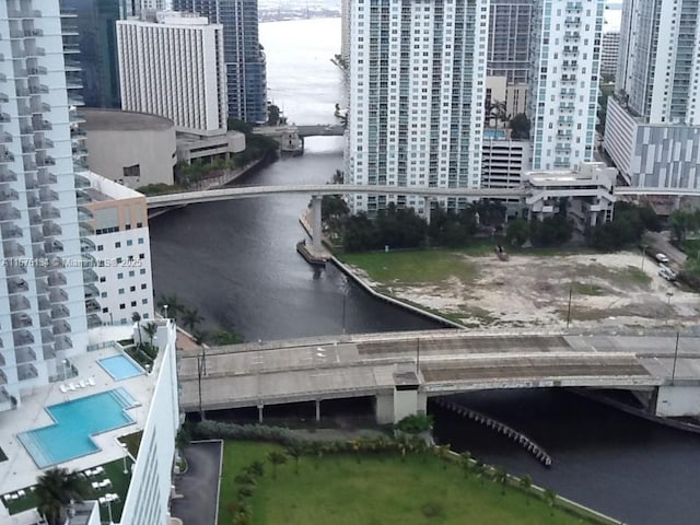 aerial view featuring a view of city and a water view