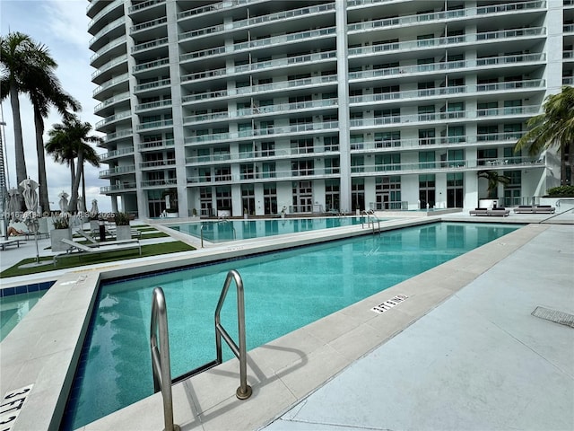 community pool with a patio