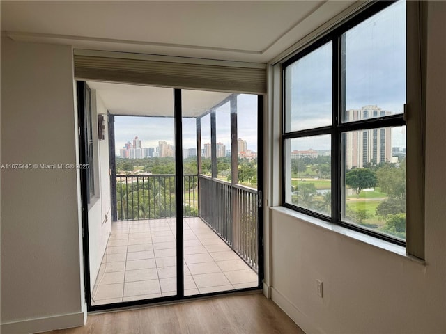 unfurnished sunroom with a view of city