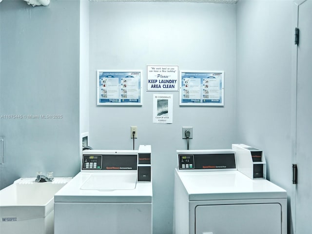 shared laundry area featuring a sink and independent washer and dryer