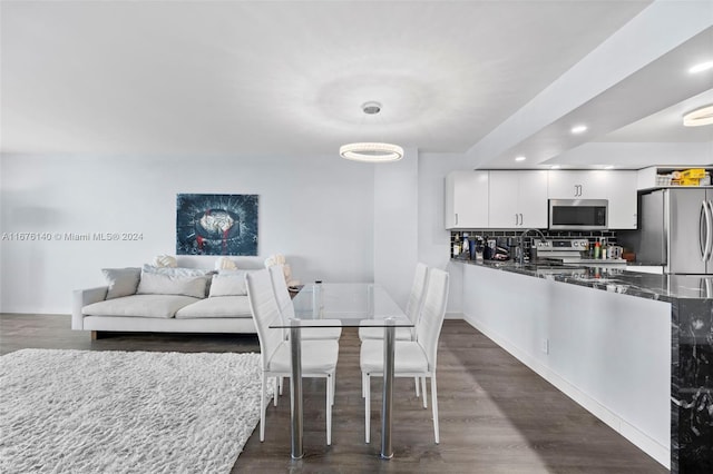 dining room featuring dark wood-type flooring