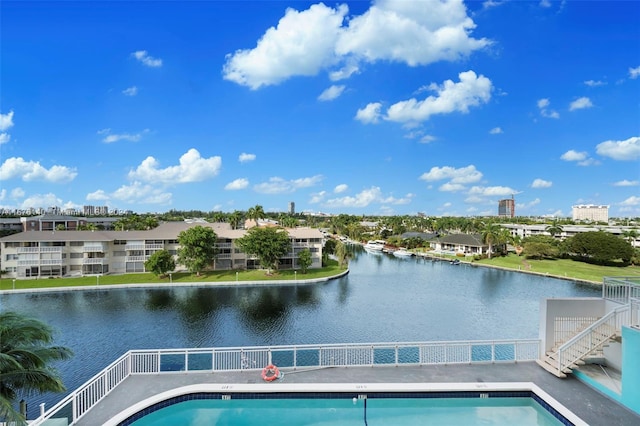 view of pool featuring a water view