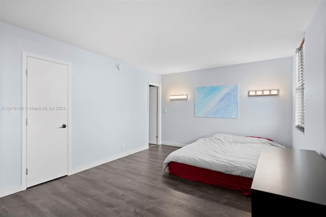 bedroom with hardwood / wood-style flooring