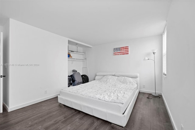 bedroom featuring dark hardwood / wood-style flooring