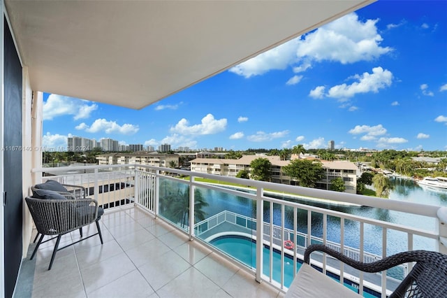 balcony featuring a water view