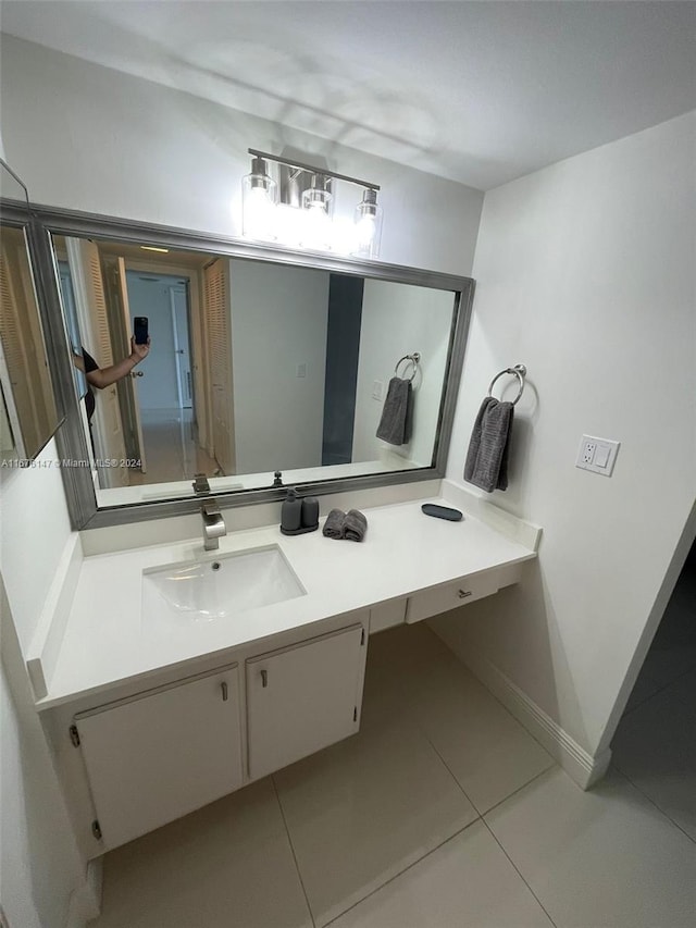 bathroom featuring tile patterned floors and vanity