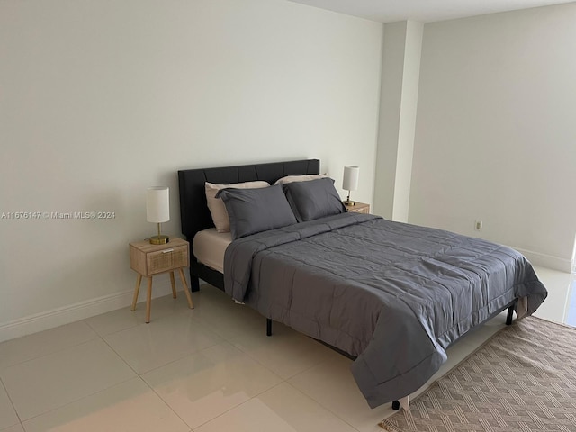 bedroom with light tile patterned floors