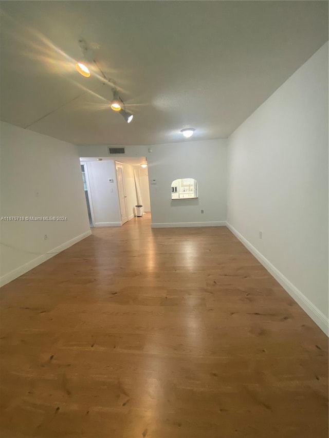 unfurnished room featuring hardwood / wood-style floors