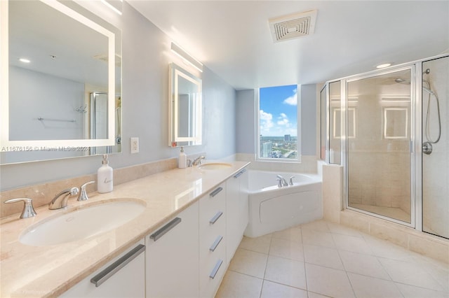 bathroom featuring separate shower and tub, tile patterned floors, and vanity