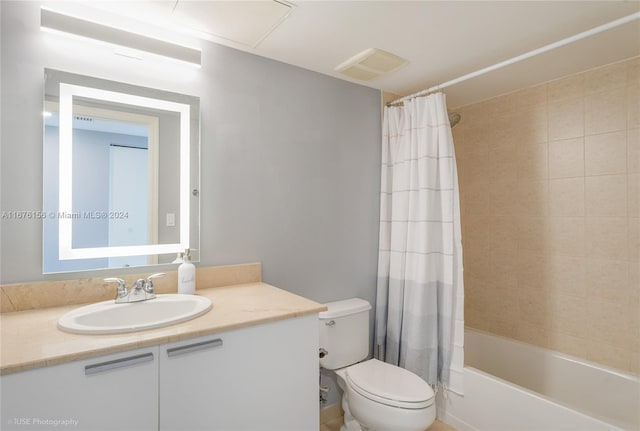 full bathroom featuring vanity, toilet, and shower / bath combo