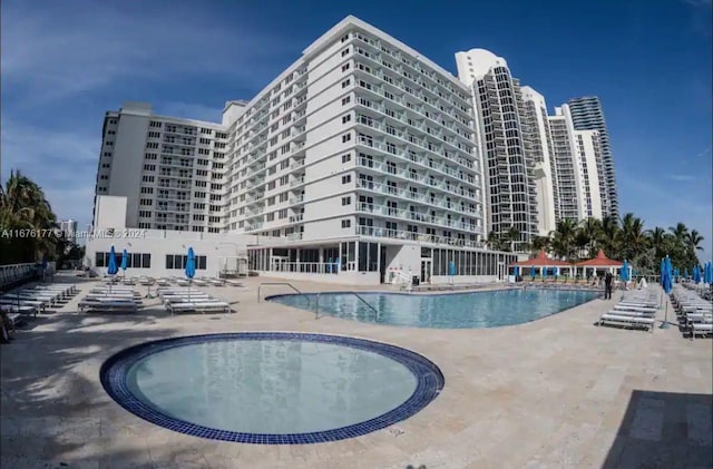 view of swimming pool with a patio area