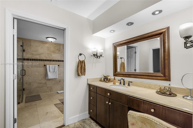 bathroom featuring walk in shower and vanity