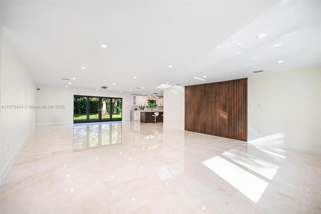 interior space featuring marble finish floor, visible vents, and recessed lighting