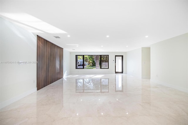 unfurnished room featuring marble finish floor, baseboards, visible vents, and recessed lighting