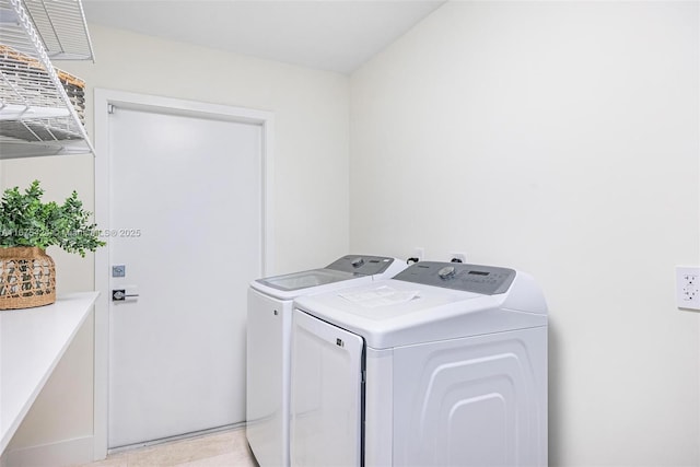 washroom with laundry area and washer and dryer