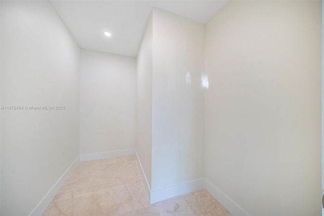 interior space with recessed lighting and baseboards