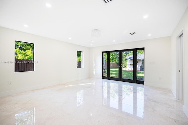 spare room featuring marble finish floor, baseboards, french doors, and recessed lighting