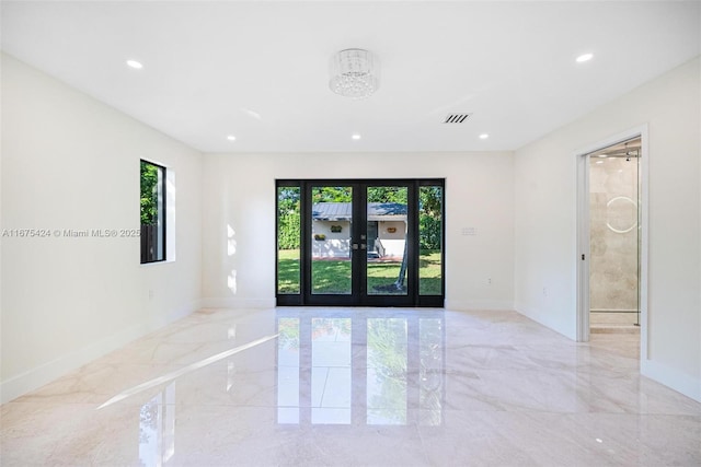 spare room featuring baseboards, visible vents, marble finish floor, french doors, and recessed lighting