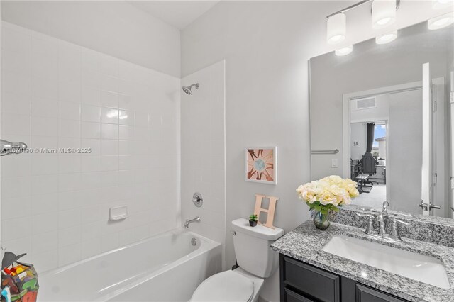 bathroom with a shower with shower door and vanity