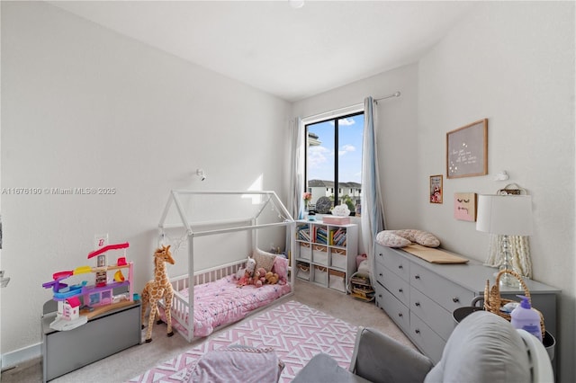 bedroom featuring carpet flooring and baseboards