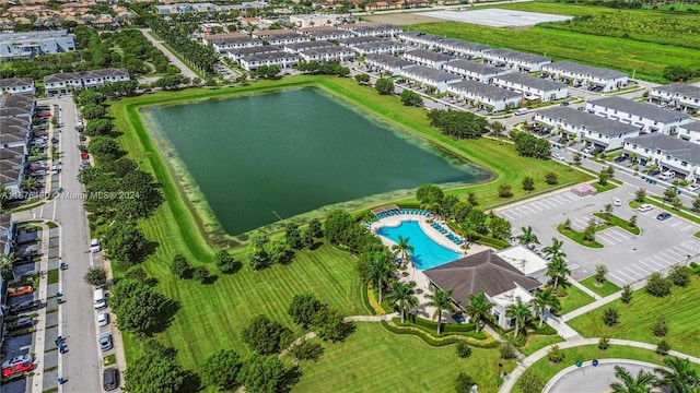 birds eye view of property with a water view