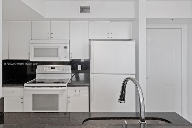 kitchen featuring white cabinets, white appliances, sink, and decorative backsplash